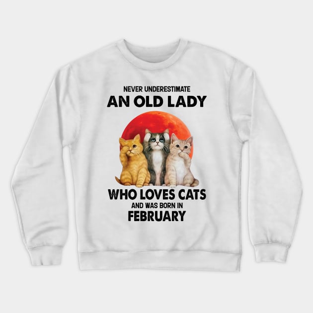 Never Underestimate An Old Lady Who Loves Cats And Was Born In February Crewneck Sweatshirt by Bunzaji